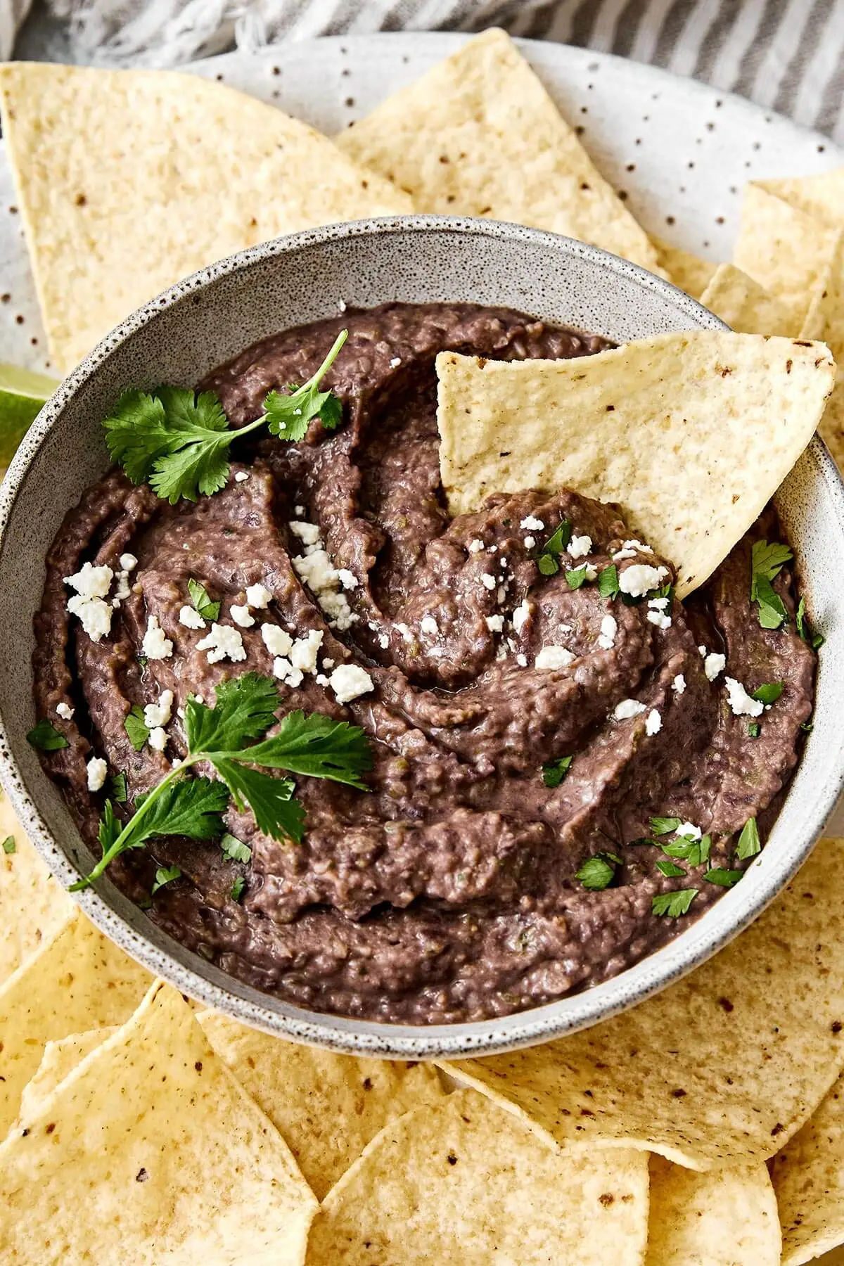 Creamy black bean dip with tortilla chips.