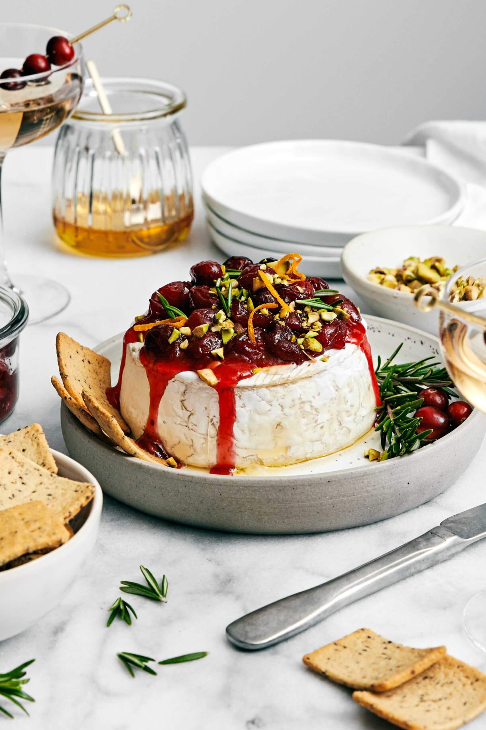 The most perfect baked brie with cranberry sauce for a festive, holiday appetizer! Plus, it's made in under 10 minutes. Baked brie with cranberry sauce.