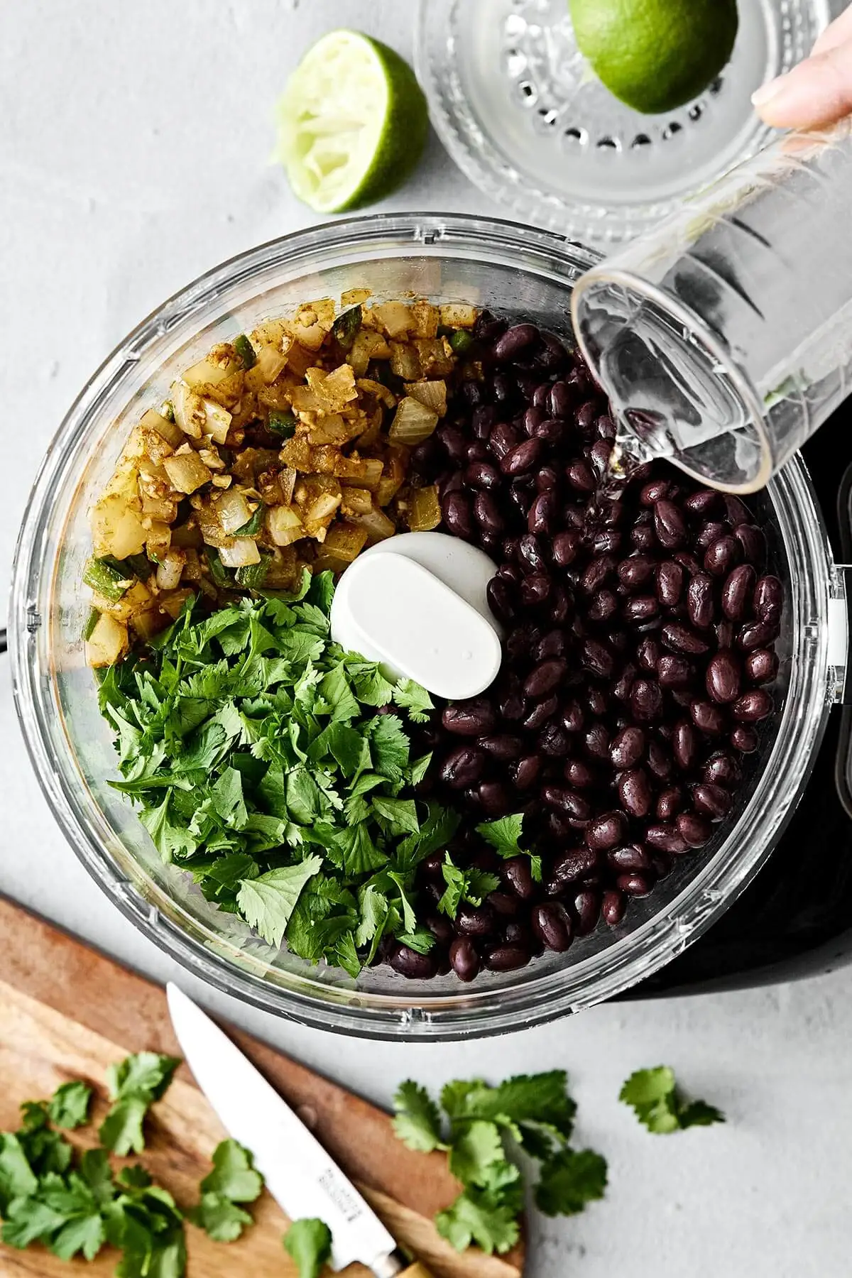 Black bean dip ingredients in a food processor.