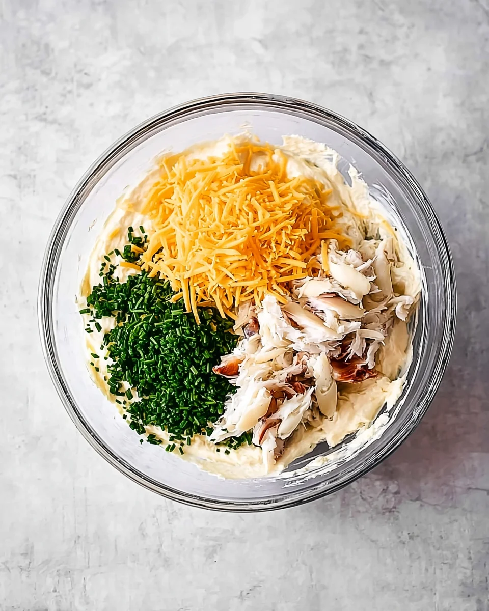 Crab dip ingredients in a bowl.