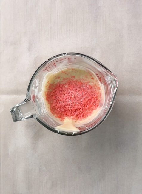 Popping candy added to melted white chocolate