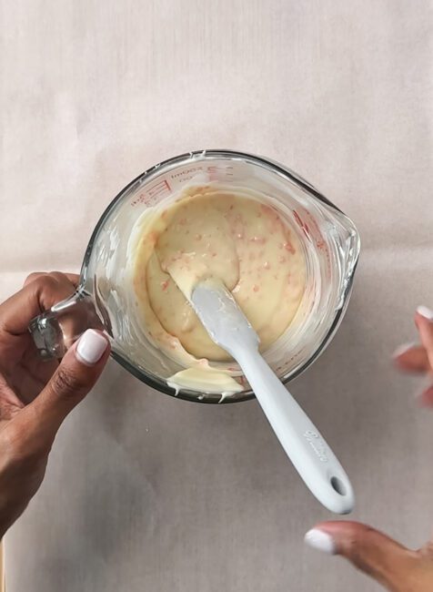 Popping candy mixed into melted white chocolate