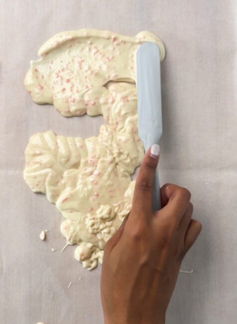 spreading melted Popping Candy Chocolate Bark