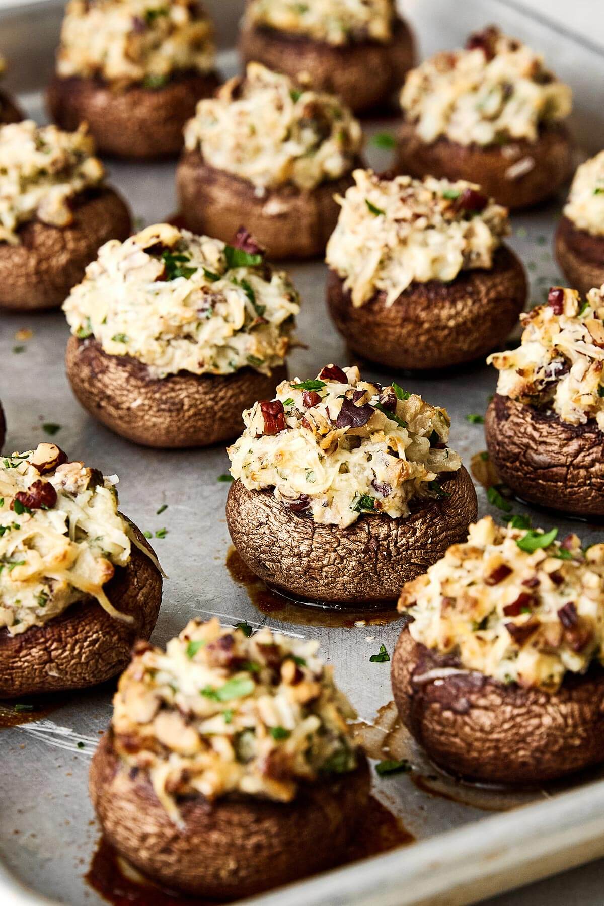 Stuffed mushrooms are always a holiday favorite! They're the perfect cheesy mushroom bite with hints of onion, herbs, and pecans. Baked stuffed mushrooms.