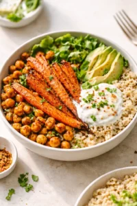 Final plated One-Pan Roasted Carrot and Chickpea Bowl served as a hero shot