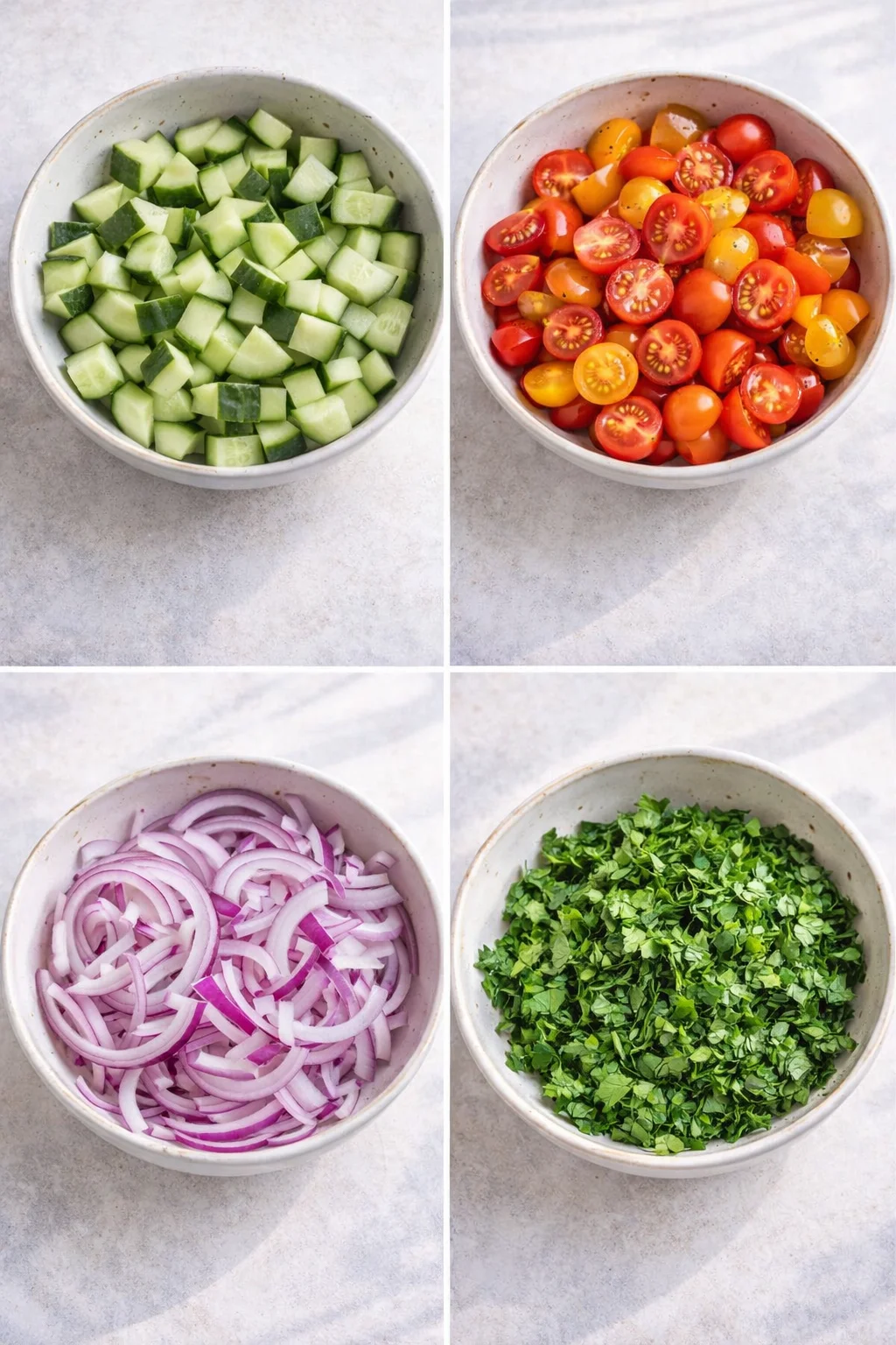 Chopped cucumbers, halved cherry tomatoes, thin red onion slices, and chopped parsley on cutting board.