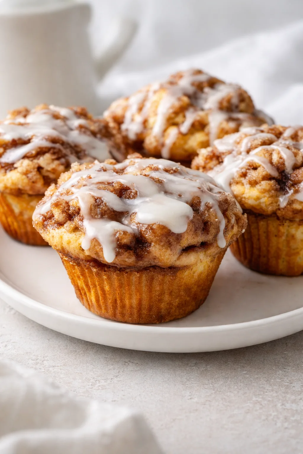 Final plated Cinnamon Roll Muffins: Irresistibly Soft & Gooey Bites You’ll Crave! served as a hero shot