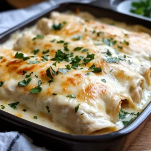 Creamy White Chicken Enchiladas Recipe baked with melted Monterey Jack cheese and fresh parsley garnish.