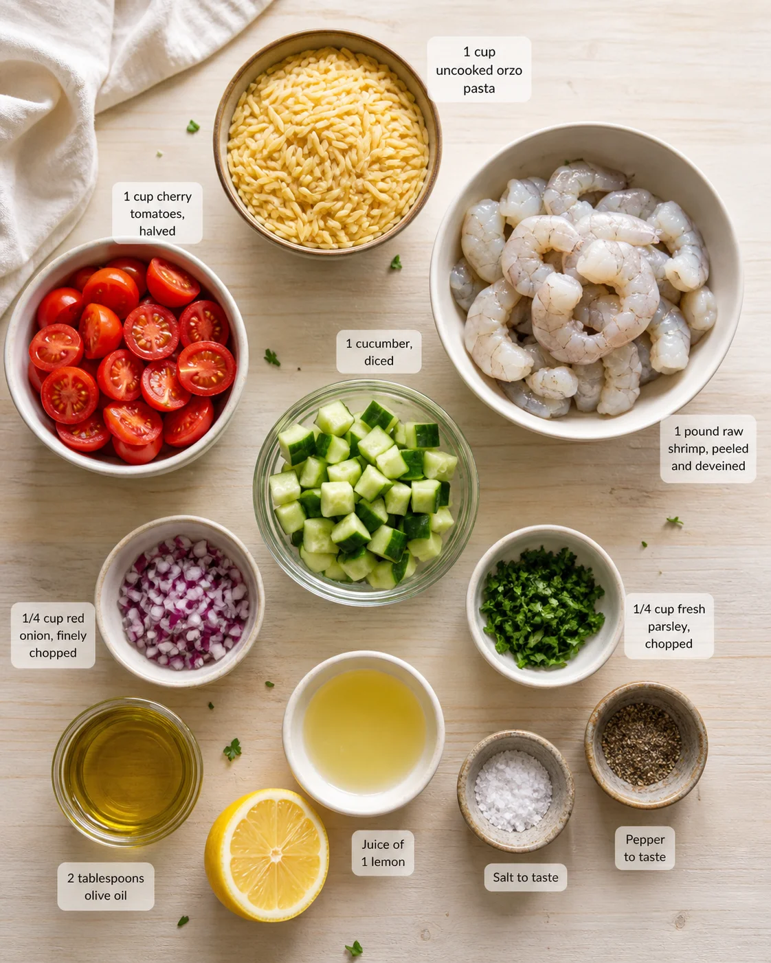 Top-down layout of shrimp pasta ingredients with labeled bowls and herbs.