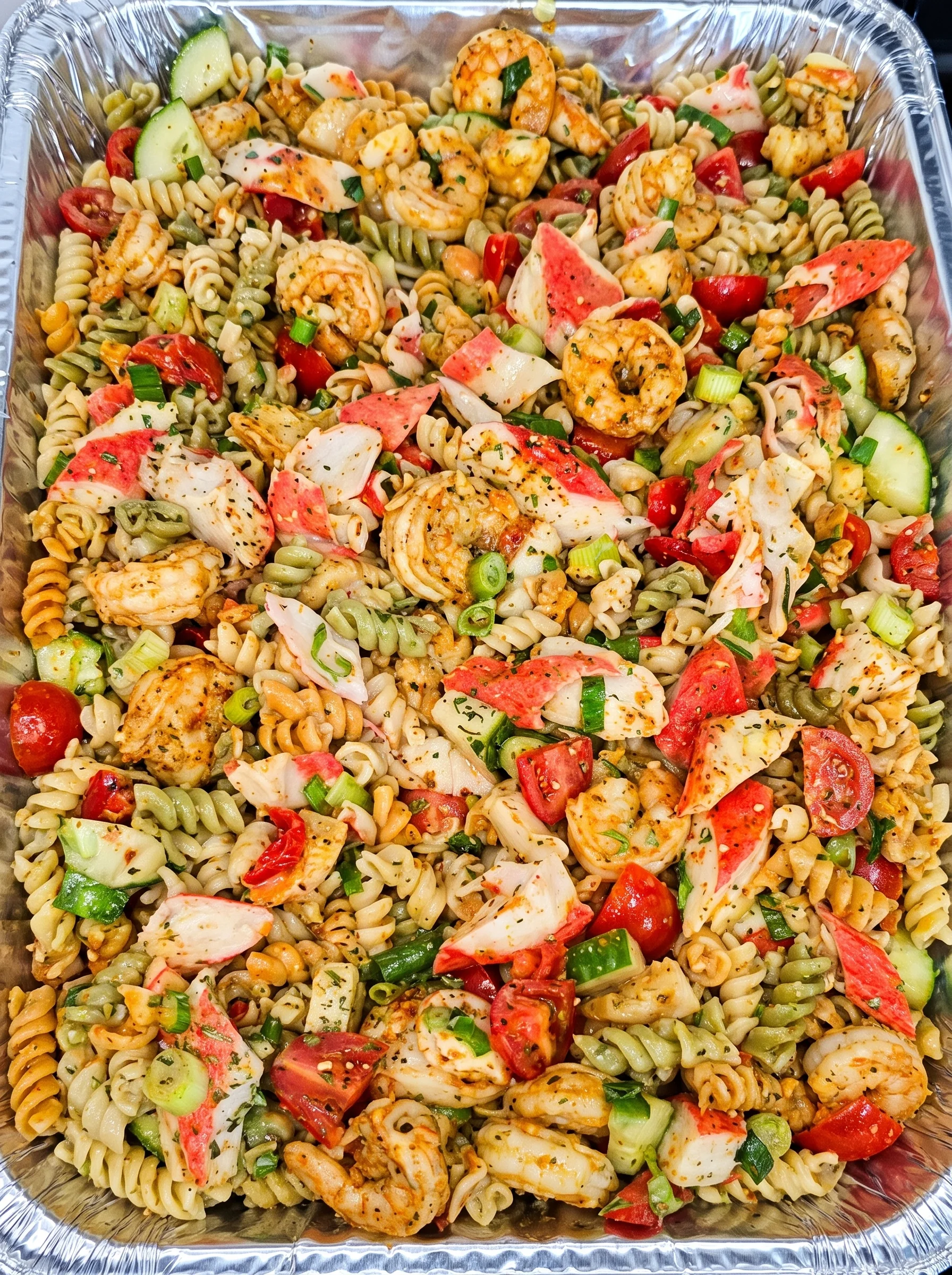Vibrant seafood pasta salad with shrimp, crab, vegetables, and Italian dressing.